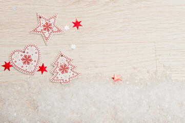 Wooden christmas decorations on light background