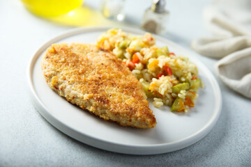 Homemade chicken schnitzel with rice and vegetables