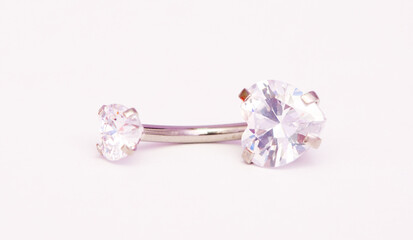 A set of jewelry for piercing on a white background. A set of earrings for the body, nose, navel, tongue, nipples, ears, various beauty jewelry, a set of cosmetological jewelry for piercing.