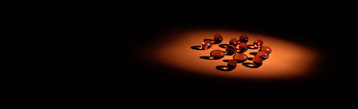 immune prevention supplement pills banner. toco-sorb supplement softgels in low key
