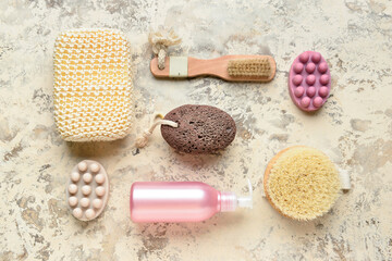 Set of bath supplies for foot massage on grunge background