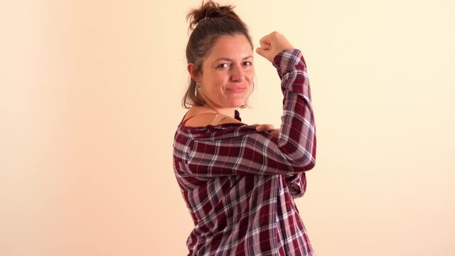 Pregnant Young Woman Showing Her Arm After Getting A Vaccine Shot, Smiling And Showing A Strong Sign