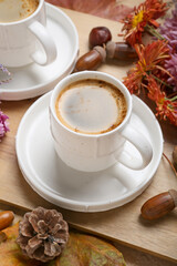 Cup of aromatic coffee on table, closeup