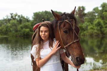 Walk with a horse near the river