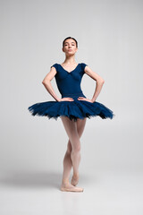 Beautiful ballerina posing in studio.