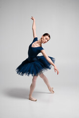 Beautiful ballerina posing in studio.