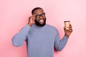 Photo of funny afro guy wear grey pullover arm glasses holding coffee cup isolated pink color background