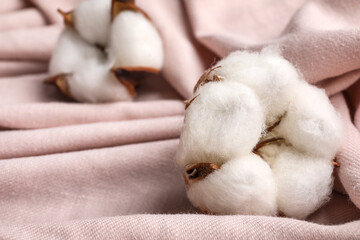 Cotton flower on fabric background, closeup