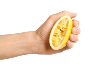 Woman squeezing lemon half on white background, closeup