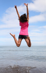 girl with long brown hair blowing in the air a symbol of happiness