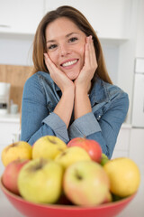 happy woman is holding apples