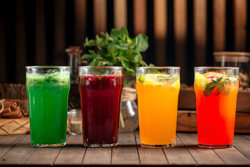 Various assorted glasses of different fruit lemonades