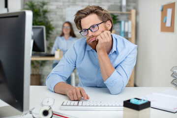 bored businessman in front of his computer