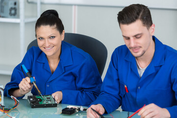 apprentices students works with electronic devices