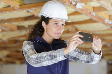 woman use mobile phone in construction work site
