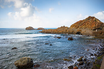 Black sand volcanic beach and view of Anaga mountains on northern coast Tenerife island, Spain