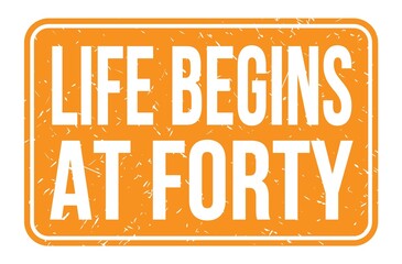 LIFE BEGINS AT FORTY, words on orange rectangle stamp sign