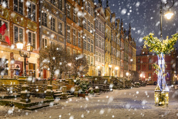 Beautiful Christmas decorations in the old town of Gdansk at snowy night. Poland