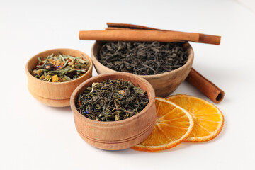 Concept of cooking tea with different types of tea on white background