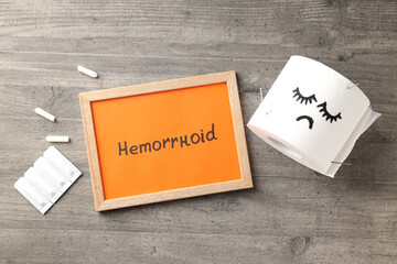 Concept of healthcare with hemorrhoids accessories on gray textured background