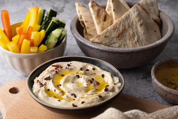 Chickpea hummus with sliced peppers, cucumbers and pita.