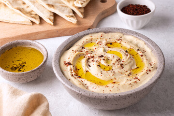 Chickpea hummus seasoned with olive oil and paprika.