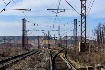 Fototapeta na wymiar View on slag heaps of the iron ore quarry and railroad