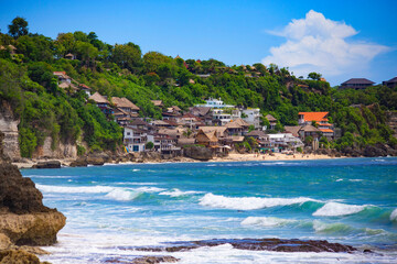 Obraz premium Beautiful sunny Dreamland beach with villas and beach houses along the coast, Bali, Indonesia