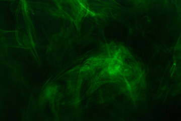 Green steam on a black background.
