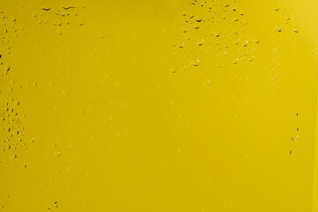 Yellow backgrond with water drops.