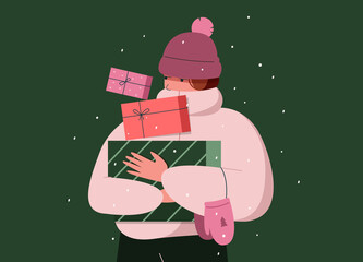 Girl in winter clothing with christmas gift boxes 