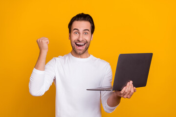 Photo of cool brunet young guy hold laptop yell wear white outfit isolated on bright yellow color...