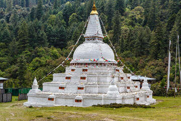 White stupa and temple in the mountains Chendebji Chorten, Phobjikha Valley, Bhutan, Asia