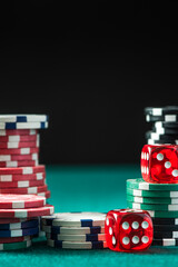 Poker Chips and Dices on Green Poker Table. Casino Background