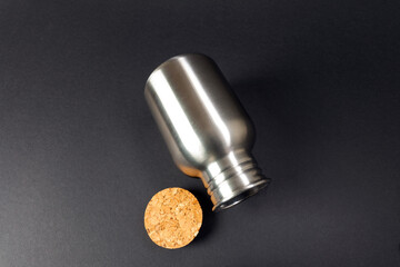 lying steelbottle refillable with cork stopper for black background