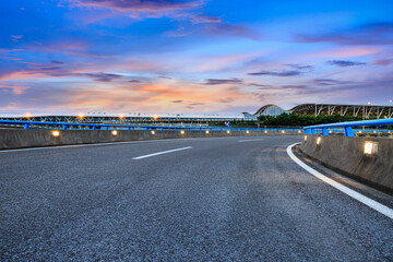 Fototapeta premium Empty asphalt road with modern skyline and buildings at the airport