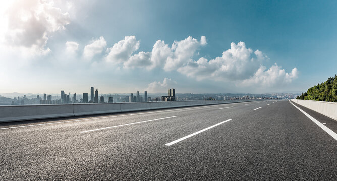 Panoramic skyline and buildings with empty road