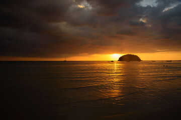 Sunset and rain cloud at Kata beach, Phuket