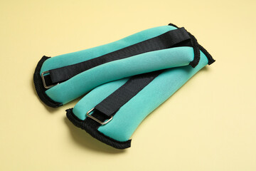 Stylish turquoise weighting agents on beige background