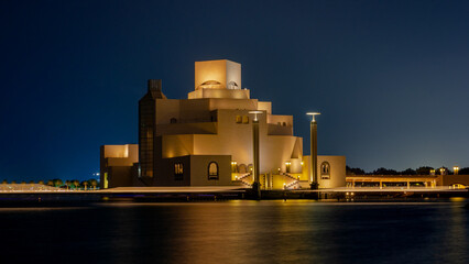 Qatar museum during night, hot with long exposure at night. - obrazy, fototapety, plakaty