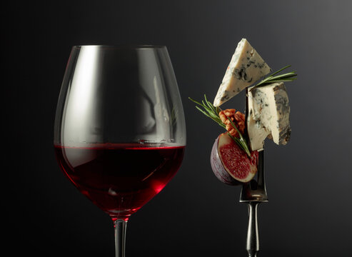 Red wine with blue cheese, figs, walnuts, and rosemary.