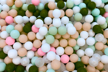 Multi-colored balls in the pool top view