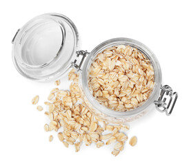 Raw oatmeal and glass jar on white background, top view