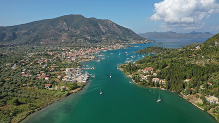 Fototapeta na wymiar Aerial drone photo of fjord shaped port of Nydri a calm sea safe anchorage for sail boats and yachts famous for trips to Meganisi, Skorpios and other Ionian islands, Lefkada island, Greece