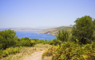 Fototapeta na wymiar Landscape with azure water of the Ionian Sea in Ksamil, Albania 