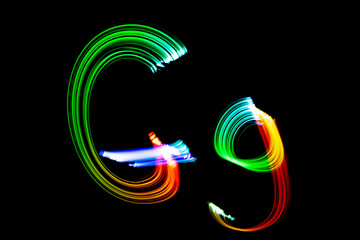 Letter G. Isolated figure on a black background. Freezelight.