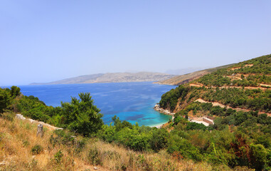 Fototapeta na wymiar Landscape with azure water of the Ionian Sea in Ksamil, Albania 