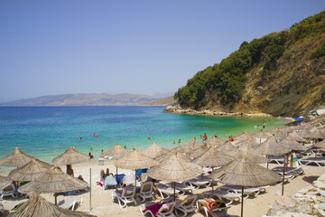 Beach with azure water of the Ionian Sea in Ksamil, Albania	

