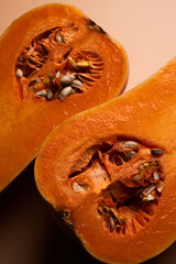 Sliced ripe pumpkin close up orange background