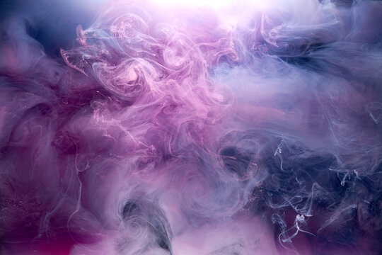 Purple smoke on black ink background, colorful fog, abstract swirling purple ocean sea, acrylic paint pigment underwater